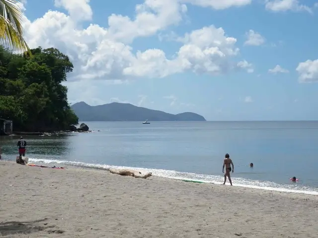 Madiana beach, the sand and calm sea under the clouds