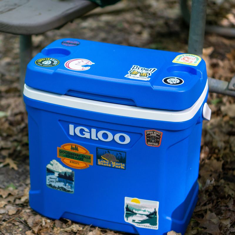 A rigid blue cooler, lid closed