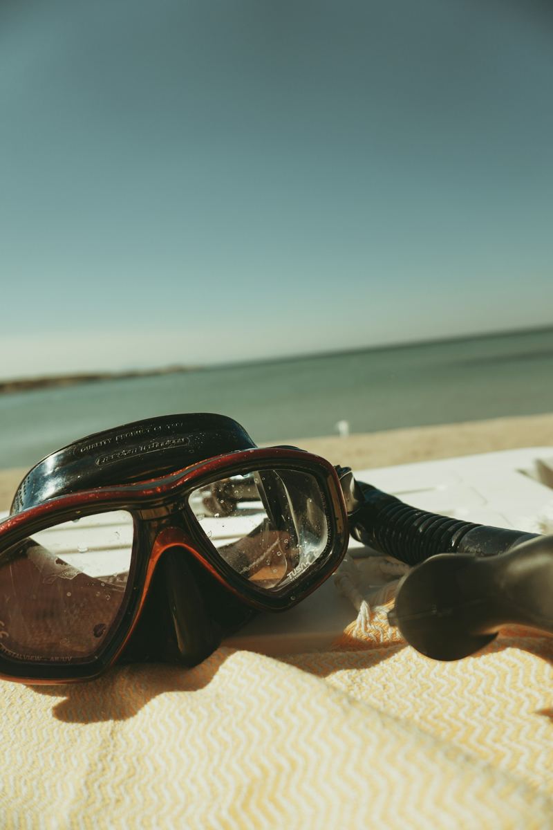 Mask and snorkel lying on the sand